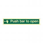 The photo shows a high-quality Spectrum Industrial Safety Signs Push Bar To Open Sign. It is made of 1.3mm rigid self-adhesive photoluminescent material and measures 300mm x 100mm. The sign has clear and bold text with universal symbols, providing clear instructions and enhanced visibility in low light conditions.