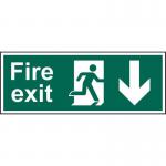 The photograph captures a Spectrum Industrial Fire Safety Sign featuring a bold red and white design with a man arrow down symbol. Its self-adhesive vinyl material and 300mm x 100mm size make it suitable for any fire exit location.