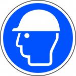 This photo shows a bright and vibrant Spectrum Industrial Floor Graphic depicting a safety helmet symbol. It is anti-slip and laminated, measuring 400mm in diameter. Perfect for promoting workplace safety and visibility.