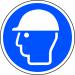 This photo shows a bright and vibrant Spectrum Industrial Floor Graphic depicting a safety helmet symbol. It is anti-slip and laminated, measuring 400mm in diameter. Perfect for promoting workplace safety and visibility.