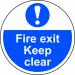 This floor graphic features the Spectrum Industrial Fire & Safety logo and text, with a bold arrow pointing towards a clear fire exit. The anti-slip laminated finish ensures safety while the 400mm diameter makes it highly visible. Perfect for industrial settings.