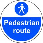 This photo shows a brightly colored floor graphic by Spectrum Industrial. The round design is labeled as a Pedestrian Route and promotes safety with its anti-slip lamination. The diameter is 400mm.