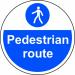 This photo shows a brightly colored floor graphic by Spectrum Industrial. The round design is labeled as a Pedestrian Route and promotes safety with its anti-slip lamination. The diameter is 400mm.