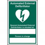 The photograph shows a set of Spectrum Industrial First Aid Signs, featuring an Automated External Defibrillator and the nearest location marked in 1.2mm lettering. Made from recyclable PP material, this sign measures 200 x 300mm.