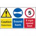 This photograph features a bright yellow Spectrum Industrial Caution Sign with bold black text and symbols. The sign cautions pedestrians to be careful and includes a reminder to sound your horn. The speed limit is set at 5mph and the sign is made of 1.2mm recyclable PP. Its size is 500 x 300mm.