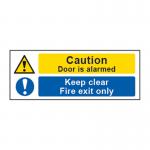 This picture shows a Spectrum Industrial Caution Sign with the words Door is alarmed Keep clear and Fire exit only printed on it. The sign is made of 1.2mm thick recyclable PP material and measures 400 x 150mm. The bright yellow color and bold font make it easy to spot and the clear message promotes safety and proper use of the door.