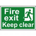 The photo features a Spectrum Industrial Fire Safety Sign with the words Fire Exit Keep Clear boldly displayed in black and red lettering. Made of 1.2mm recyclable PP material, the sign measures 300 x 200mm. Bright and highly visible, it provides clear direction for safe evacuation during a fire emergency.
