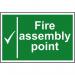 The photo shows a Spectrum Industrial Fire Safety Sign for a fire assembly point. The sign is made of 1.2mm recyclable PP material and measures 300 x 200mm. The bright red and white colors stand out, and the text is clear and easy to read. The arrow pointing towards the assembly point and the fire symbol indicate the purpose of the sign. Overall, the sign appears durable and effective for its intended use.