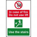 This image shows a set of Spectrum Industrial Fire Safety Signs. The sign is made of 1.2mm recyclable PP and is 200 x 300mm in size. The text reads In case of fire, do not use lift, use stairs. The color of the sign is bright yellow with bold, black text, making it easily visible. These signs are designed to increase fire safety in industrial settings.