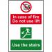 This image shows a set of Spectrum Industrial Fire Safety Signs. The sign is made of 1.2mm recyclable PP and is 200 x 300mm in size. The text reads In case of fire, do not use lift, use stairs. The color of the sign is bright yellow with bold, black text, making it easily visible. These signs are designed to increase fire safety in industrial settings.