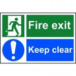 The photograph shows a bright red Spectrum Industrial Fire Safety Sign with bold, white lettering that reads Fire Exit Keep Clear on a 1.2mm thick, recyclable PP material. The sign measures 300 x 200mm and features a universal fire exit symbol. The sturdy construction and clear messaging make it an essential addition to any industrial setting to ensure the safety of all.