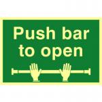 The picture shows a 300mm x 200mm industrial fire safety sign with the words Push Bar To Open in bold lettering. The sign is made of 1.3mm rigid self adhesive photoluminescent material, making it easily visible in low light or emergency situations. The background of the sign is a bright green color with black and white graphics. This sign is designed to ensure safety and clearly communicate emergency procedures in the event of a fire.