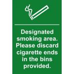 This photograph features a Spectrum Industrial No Smoking Sign with a designated smoking area design. Made of 1.2mm recyclable PP, the sign measures 200 x 300mm and reminds people to properly discard cigarette ends.