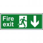 The photo shows a Spectrum Industrial Fire Safety Sign with a running man and an arrow pointing down. It is made of 1.2mm recyclable PP and measures 400 x 150mm. The sign is clearly labeled with the word Fire Exit and is designed for use in industrial settings. The bright green color and bold lettering make it easily visible and the sturdy material ensures durability.
