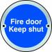 The photograph shows a Spectrum Industrial Room Signs Fire Door Keep Shut Door Disc in SAA color with a diameter of 75mm. The fire door is prominently displayed, with clear instructions and warning signs in easy-to-read text. The sleek design and sturdy construction of the sign can be seen, making it a valuable addition to any industrial setting.