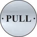 The photo shows a set of Spectrum Industrial Room Signs with Pull Door Disc design. The signs are made of satin anodised aluminium and have a diameter of 75mm. They can add a modern and professional look to any industrial space.