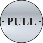 The photo shows a sleek and modern Spectrum Industrial Room Sign with a silver satin finish. The round disc, measuring 75mm in diameter, features a pull door design and is made of sturdy stainless steel.