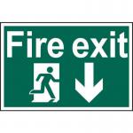The photograph features a vibrant Spectrum Industrial fire safety sign with the iconic running man symbol and an arrow pointing downwards for a clear fire exit route. Made from recyclable 1.2mm PP material, the sign measures 600 x 400mm in size.