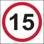 The picture shows a Spectrum Industrial Road and Traffic Signs 15mph Speed Limit Sign made of 3mm Foamed PVC Board, measuring 400mm x 400mm. It features bold black lettering on a bright yellow background, clearly indicating the speed limit. The sign is mounted on a sturdy pole and placed on the side of the road, easily visible to drivers.