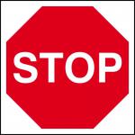 The image shows a Spectrum Industrial road with traffic signs, including a red stop sign. The sign is made of 3mm Foamex board and measures 400mm x 400mm. Bright colors and clear text make it easily visible for drivers on the road.