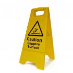 This picture shows a yellow caution sign warning of a slippery surface, displayed on a heavy duty A board measuring 620mm x 200mm. The sign features the words Caution Slippery Surface in bold white letters against a black background.