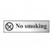 The photo features a Spectrum Industrial No Smoking Sign made of chrome-effect self-adhesive PVC material. The rectangular sign measures 200mm x 50mm and clearly states No Smoking in bold, black lettering against a white background. The sleek design and easy application make it a practical addition to any workplace.