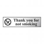 The image shows a sleek chrome-effect no smoking sign with bold white lettering, reading Thank You For Not Smoking. The sign is self-adhesive and made of durable PVC material, measuring 200mm x 50mm. It is designed for industrial use.