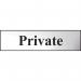 The photo shows a Spectrum Industrial Room Sign in a chrome effect. It is made of self-adhesive PVC and measures 200mm x 50mm. The sign features the word Private in bold letters, indicating a restricted area. The overall design is sleek and professional, perfect for any industrial setting.
