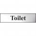 The photo shows a chrome-effect Spectrum Industrial Washroom Sign displaying the word Toilet. The self-adhesive PVC sign measures 200mm x 50mm and features sleek, modern design. Perfect for any industrial or commercial washroom setting.