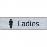 This photo features a Spectrum Industrial washroom sign for ladies, with a stainless steel effect. Made of self-adhesive PVC, the sign measures 200mm x 50mm.