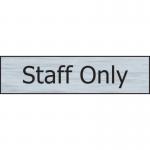 The picture shows a sleek Spectrum Industrial Room Signs Staff Only Sign made of stainless steel effect. It has a self-adhesive PVC backing and measures 200mm x 50mm. The sign is clearly marked with Staff Only in bold letters.