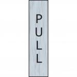 The photograph captures a sleek and modern vertical pull sign from Spectrum Industrial Room Signs. With a stainless steel effect, the self-adhesive PVC sign measures 200mm x 50mm and features bold lettering for easy readability.