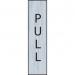 The photograph captures a sleek and modern vertical pull sign from Spectrum Industrial Room Signs. With a stainless steel effect, the self-adhesive PVC sign measures 200mm x 50mm and features bold lettering for easy readability.