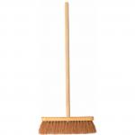 The photograph features a wide shot of various Centurion Europe Limited brushes and brooms, including a 12-inch coco brush. The products are neatly displayed and appear high-quality with sturdy wooden handles and thick bristles. A logo for the company can be seen in the corner of the image.