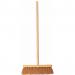 The photograph features a wide shot of various Centurion Europe Limited brushes and brooms, including a 12-inch coco brush. The products are neatly displayed and appear high-quality with sturdy wooden handles and thick bristles. A logo for the company can be seen in the corner of the image.