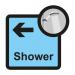 This photograph features a Spectrum Industrial Directional Sign for assisted living, specifically a shower arrow pointing left. The sign is sized at 305 x 310mm and is labeled as SA FMX.