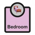 A photo of Spectrum Industrial Room Signs Assisted Living Sign shows a white rectangular sign with black text that reads Bedroom. Underneath is the acronym SA FMX. The sign is 266 x 310mm in size and is labeled ALS040.