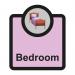 A photo of Spectrum Industrial Room Signs Assisted Living Sign shows a white rectangular sign with black text that reads Bedroom. Underneath is the acronym SA FMX. The sign is 266 x 310mm in size and is labeled ALS040.