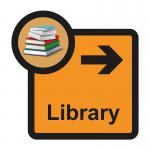 The photograph features a Spectrum Industrial Directional Sign for assisted living, specifically pointing towards the library with an arrow pointing to the right. The sign measures 305 x 310mm and has the label SA FMX on it.