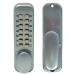 This photo features a sleek, satin chrome push button digital lock with a holdback function from Securefast PLC. The modern design and innovative technology make this lock a perfect addition to any entrance. The crisp buttons and smooth finish give it a polished look.