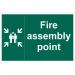 In the photo, there is a Spectrum Industrial Safety Signs Educational Sign with the words Fire Assembly Point written on it. The sign is made of PP material and measures 400 x 300mm. Its product code is EDU001.