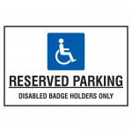 This photograph captures a Spectrum Industrial Safety Signs Educational Sign. It features reserved parking for disabled badge holders only, printed on a 400mm x 300mm PP board. The sign is clear and easy to read, with bold lettering and symbols to convey its message effectively.