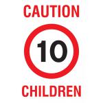 This photograph captures a yellow educational sign from Spectrum Industrial with the words Caution Children and Speed 10 in bold red text. The sign measures 400 x 300mm and is made of PP material. It is designed to promote safety in industrial settings.