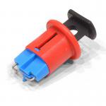 The photograph shows a Spectrum Industrial lock securing a Miniature Circuit Breaker Lockout Pin, model number LOK206, in place. The lock is attached to a standard outlet, and the bright red color makes it easy to spot. The compact size and practical design make this lock a valuable tool for workplace safety.