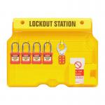 In the photograph, a large, bold sign reading Spectrum Industrial Warehouse Signage stands out against the white background. In front of the sign is a compact, black Advanced Lockout Station, labeled Small LOK231. The station is organized with various compartments and hanging hooks, filled with lockout equipment and devices. The overall appearance is sleek and professional, suitable for any industrial environment.