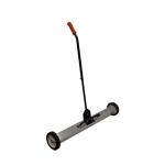 A photograph of Spectrum Industrial Brushes & Brooms 1010mm Large Magnetic Sweeper with Release MAGSW02 shows a large magnetic sweeper with a black handle and red bristles. The sweeper is being used on a concrete floor, attracting metal debris with its strong magnetic force.
