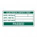 The photo features a roll of 500 small, rectangular labels with a size of 50 x 25mm. The labels are white with black text that reads PASSED Electrical safety test and Spectrum Industrial Miscellaneous Labels. The labels are organized neatly on a roll and appear to be ready for use.