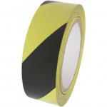 The photo shows a roll of Spectrum Industrial Quarantine Tape, featuring adhesive PVC material, designed for highlighting hazards and marking internal procedures. Its vibrant colors and reliable adhesive make it a practical tool for safety and organization.
