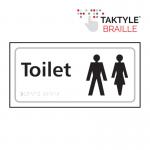 This photograph features a white Spectrum Industrial Washroom Sign with the symbol for ladies and gents in a self-adhesive Taktyle style. The sign measures 300mm x 150mm and is perfect for any washroom facility.