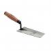 In this photo, we see a Hilka 150mm Soft Grip Bucket Trowel from Hilka Tools (UK) Limited. The trowel has a sturdy, wide blade for easy maneuvering and is adorned with a soft grip handle for comfortable use. The handle is a dark grey color, while the blade is a shiny, silver metal. The trowel appears to be in perfect condition, ready for use in any construction or gardening project.